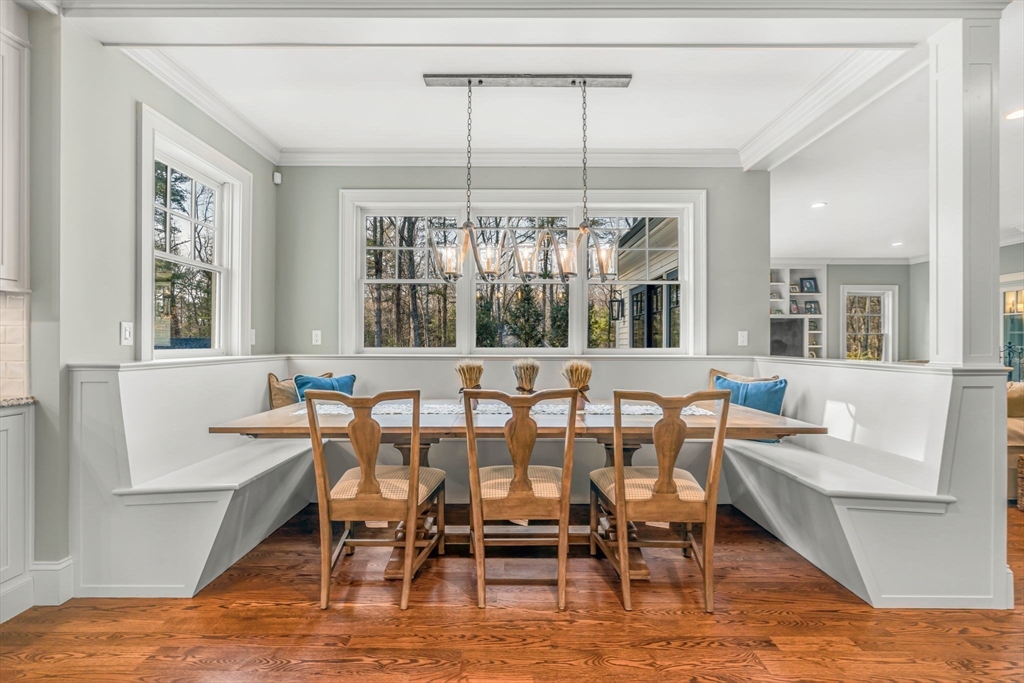 134 Pope Road Acton, MA 01720 - Photo 12 of 39 a dining room with furniture large windows and a chandelier