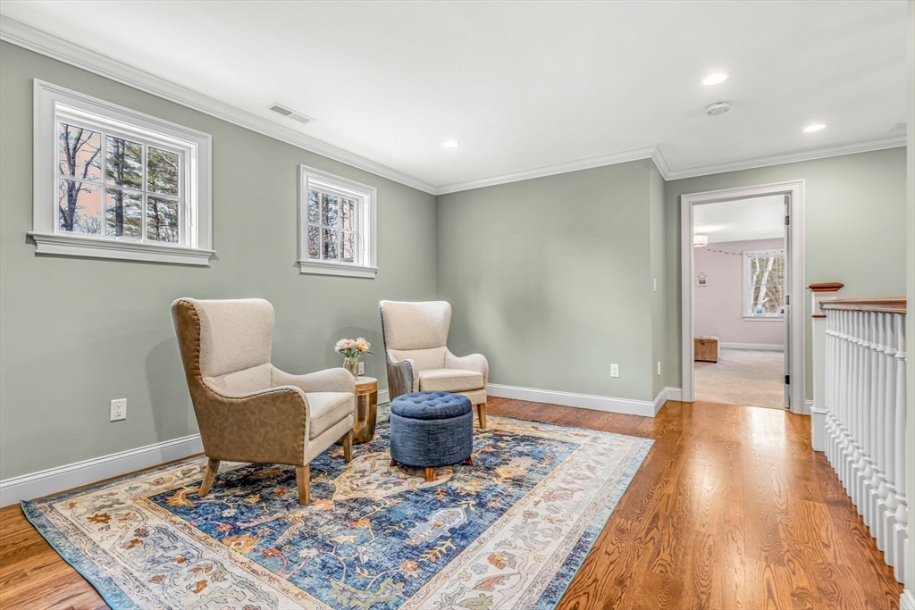 134 Pope Road Acton, MA 01720 - Photo 19 of 39 a living room with furniture and a rug