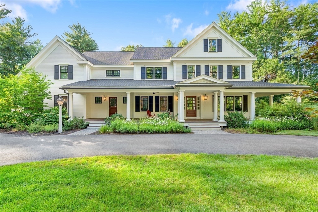 134 Pope Road Acton, MA 01720 - Photo 2 of 39 a front view of a house with a garden