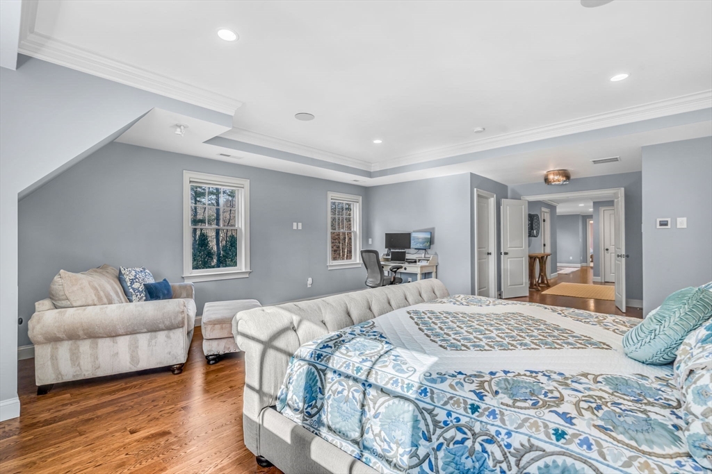 134 Pope Road Acton, MA 01720 - Photo 21 of 39 a bedroom with a large bed couch and a window