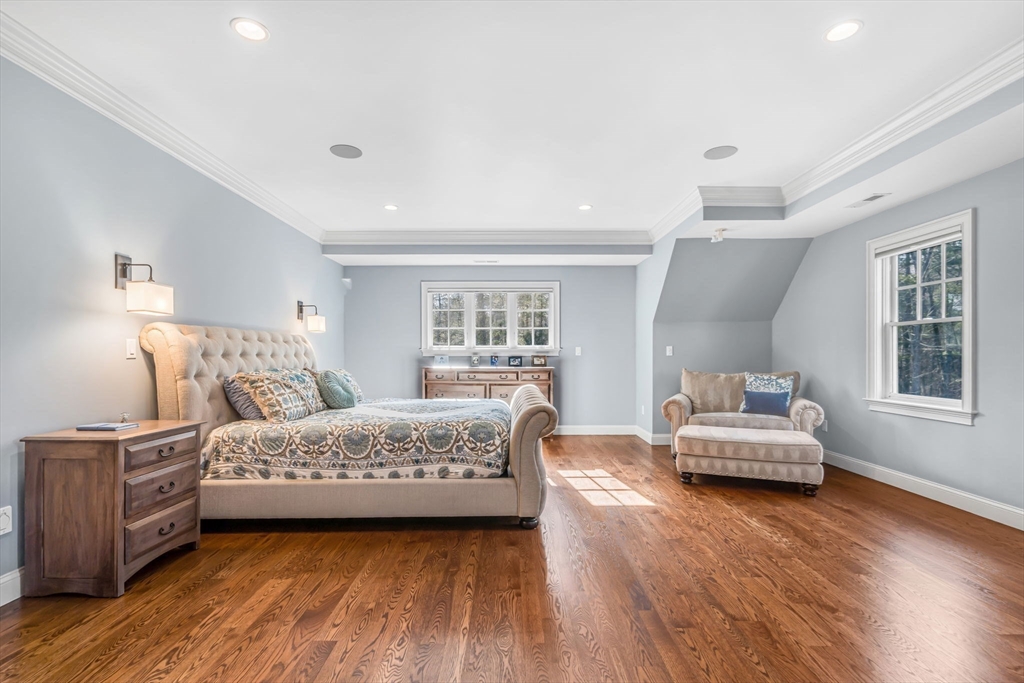 134 Pope Road Acton, MA 01720 - Photo 22 of 39 a bedroom with a bed and wooden floor