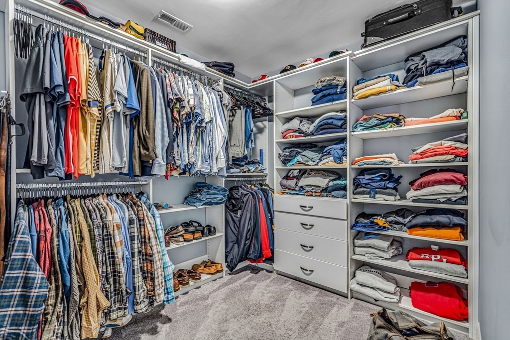 134 Pope Road Acton, MA 01720 - Photo 27 of 39 a view of walk in closet with clothes and shoes