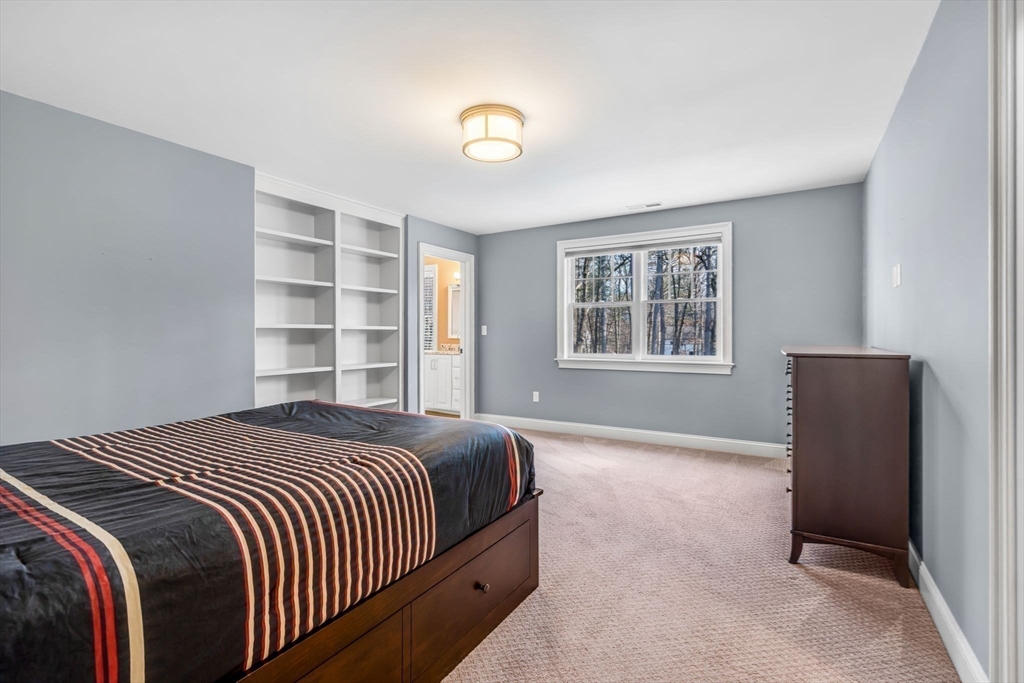 134 Pope Road Acton, MA 01720 - Photo 28 of 39 a bedroom with a bed and a window