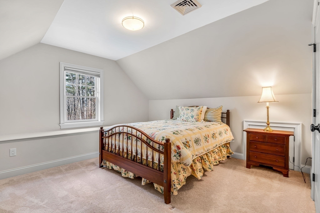 134 Pope Road Acton, MA 01720 - Photo 33 of 39 a bedroom with a bed and a window