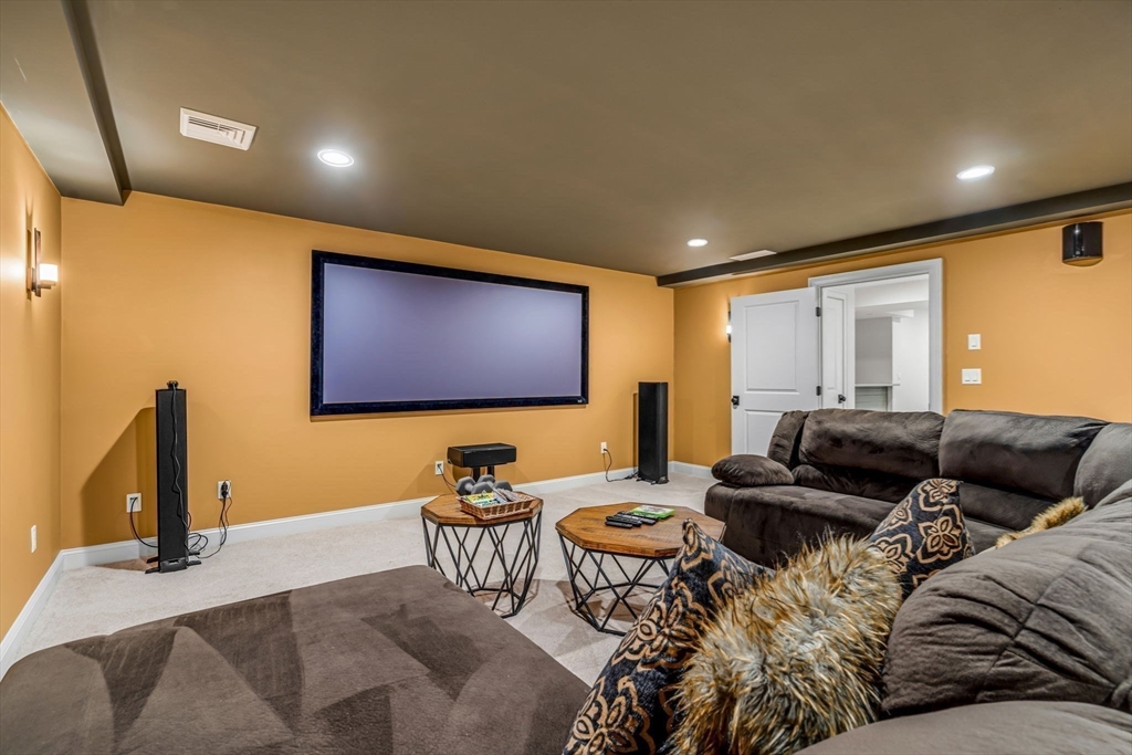 134 Pope Road Acton, MA 01720 - Photo 35 of 39 a living room with furniture and a flat screen tv