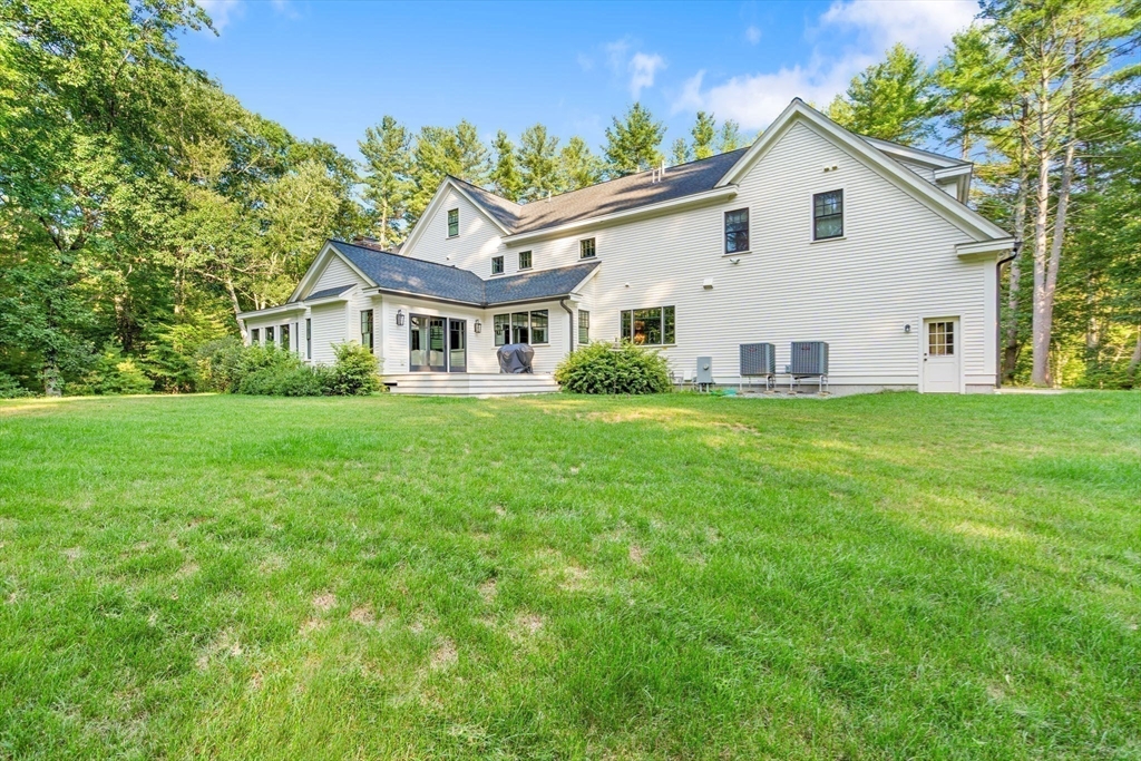 134 Pope Road Acton, MA 01720 - Photo 37 of 39 a view of a house with a yard