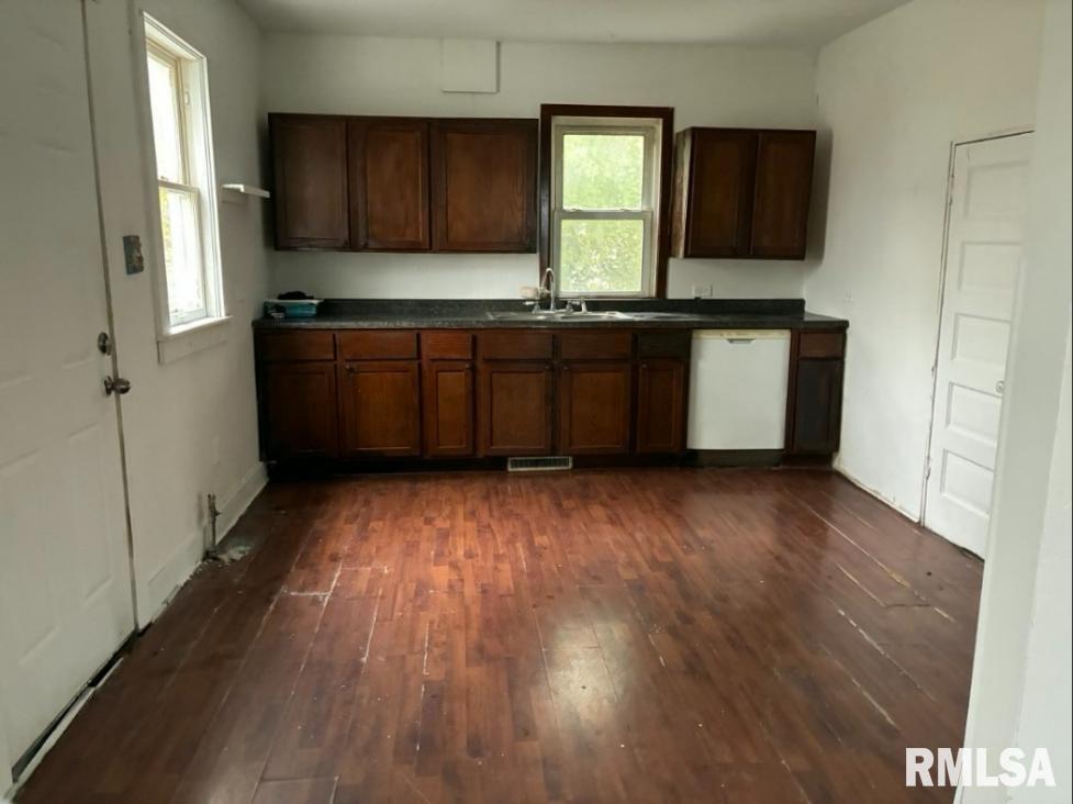 732 South Main Street Kewanee, IL 61443 - Photo 11 of 13 a kitchen with a sink and a stove top oven