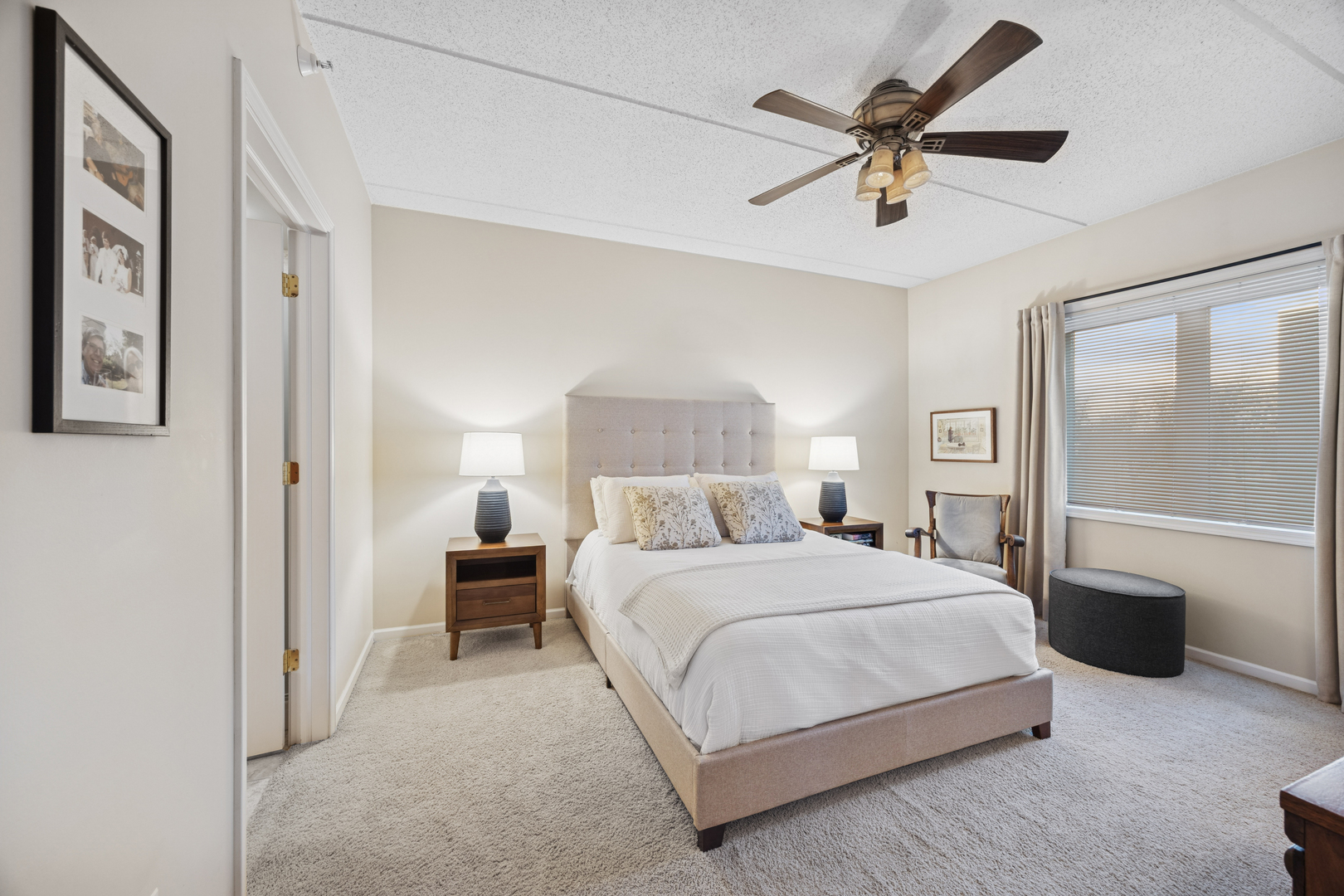 500 East St Charles Road, Unit 209 Lombard, IL 60148 - Photo 12 of 21 a bedroom with a bed and ceiling fan