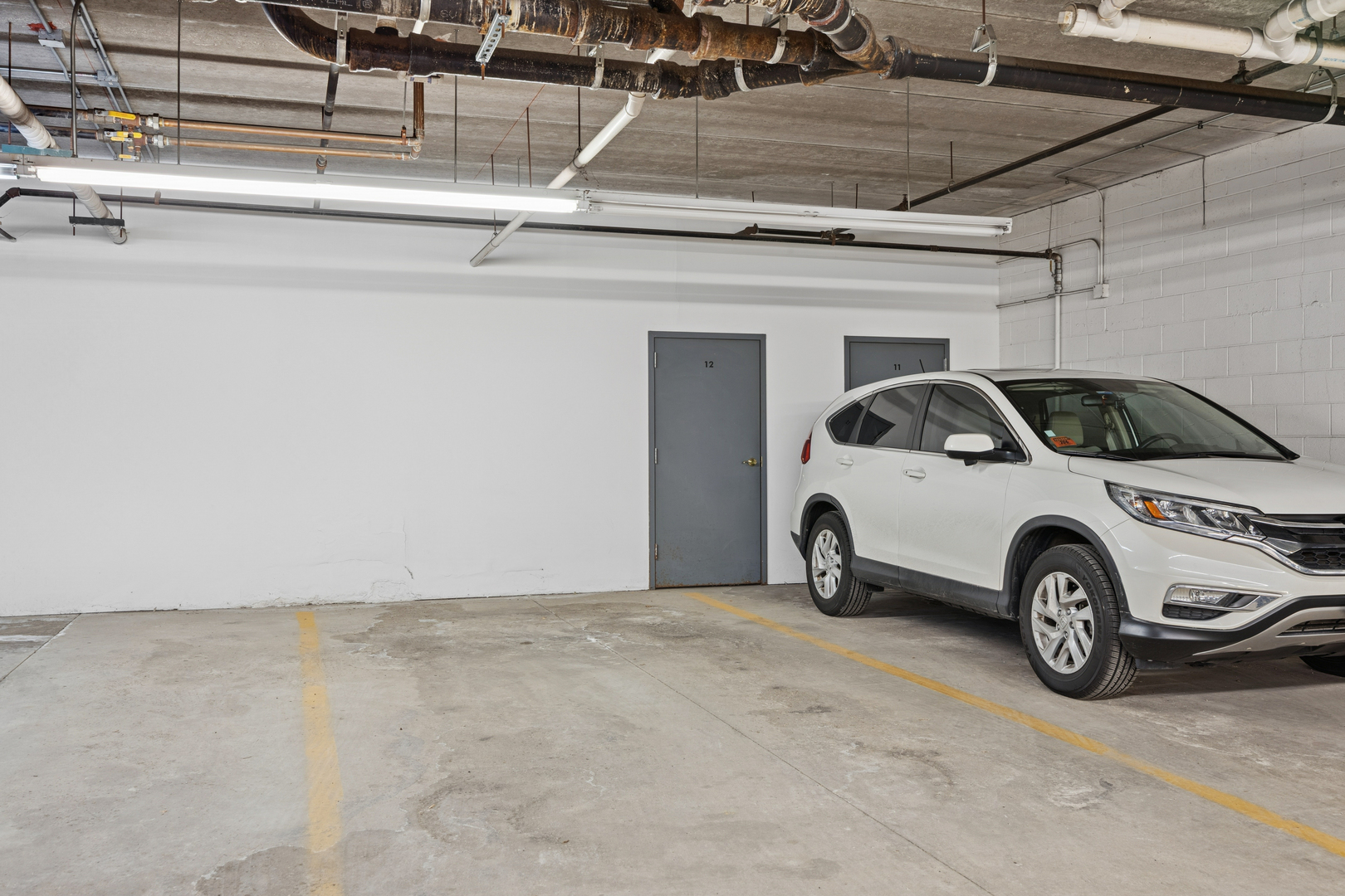 500 East St Charles Road, Unit 209 Lombard, IL 60148 - Photo 19 of 21 a view of garage with a washer and dryer
