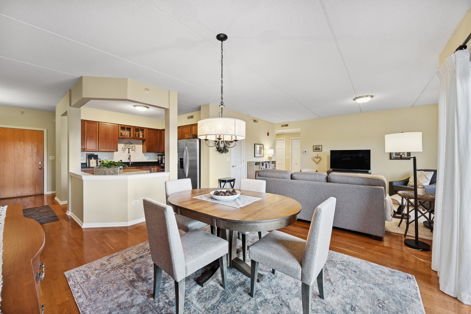 500 East St Charles Road, Unit 209 Lombard, IL 60148 - Photo 7 of 21 a dining room with furniture window wooden floor
