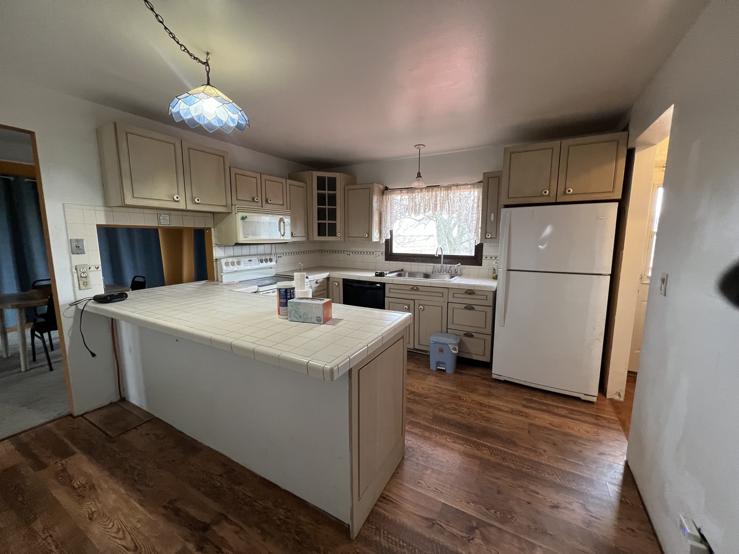2957 East Kentucky Road Beecher, IL 60401 - Photo 10 of 22 a kitchen with a sink a refrigerator a stove a microwave and cabinets