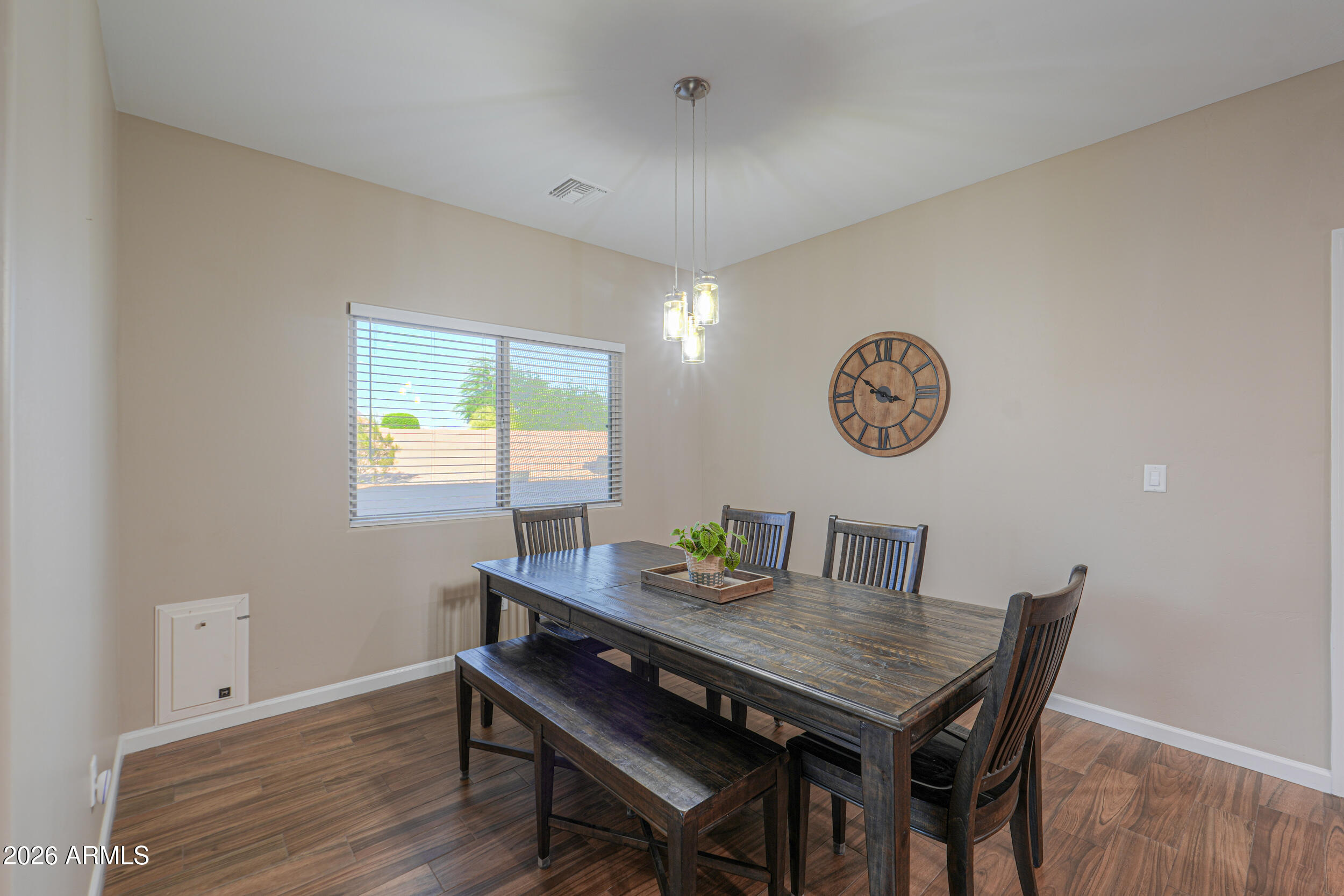 1487 South Mountain View Road Apache Junction, AZ 85119 - Photo 16 of 60 a view of a dining room with furniture and wooden floor