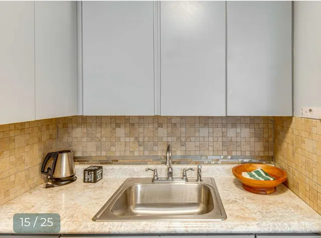 a view of staircase with white walls