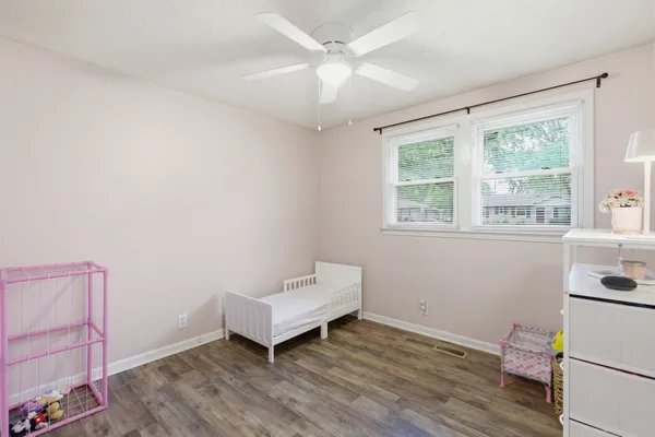 a room with a bed and a window