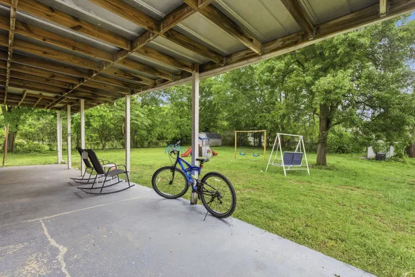 a view of a two chairs in the park
