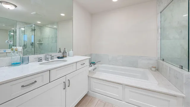 a bedroom with bed and wooden floor