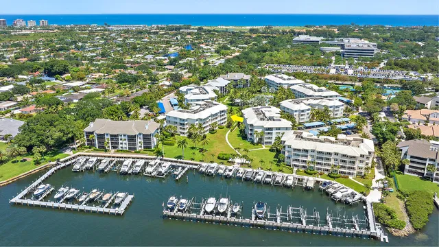an aerial view of residential houses with outdoor space and swimming pool