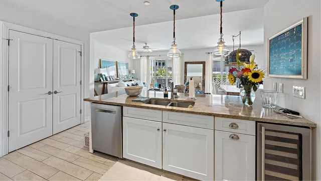 a kitchen with sink and cabinets