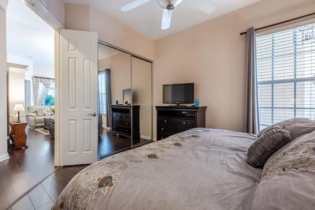 a bed room with a bed and a television