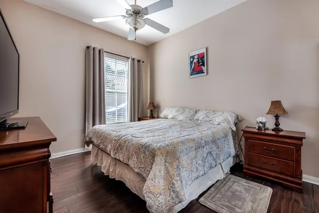 a bedroom with a bed and a dresser