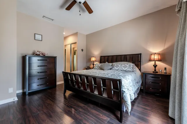 a bed room with a bed and dresser