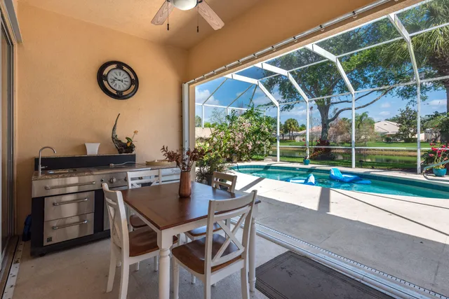 a view of a dining room with a table and chairs
