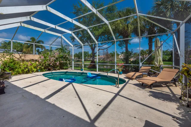 a view of a backyard with sitting area