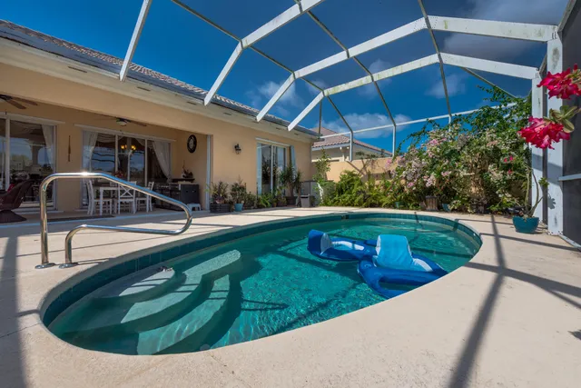 a view of a swimming pool with a patio