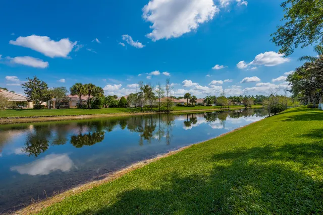 a view of a lake with houses in the back