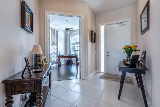 a view of a entryway and livingroom with furniture