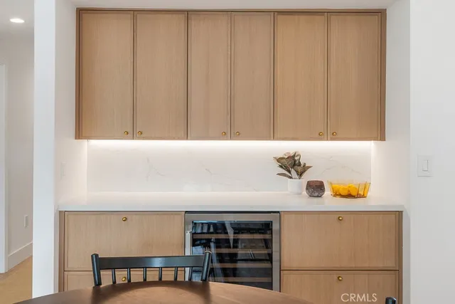 a bathroom with a granite countertop sink toilet and mirror