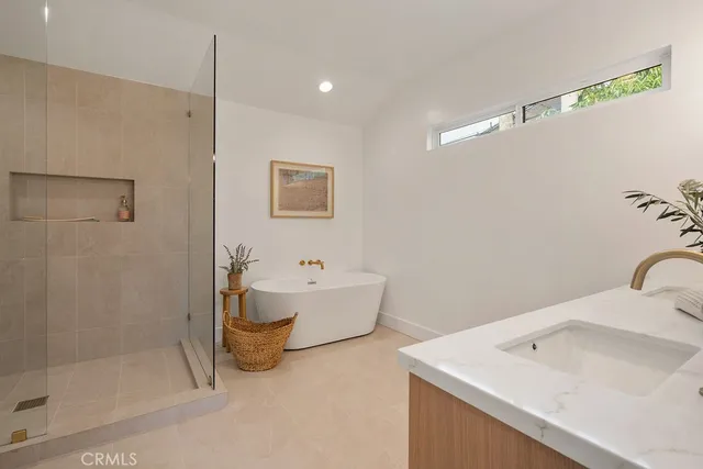 a bathroom with a shower toilet and sink