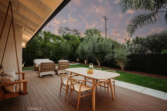 a view of house with backyard and garden