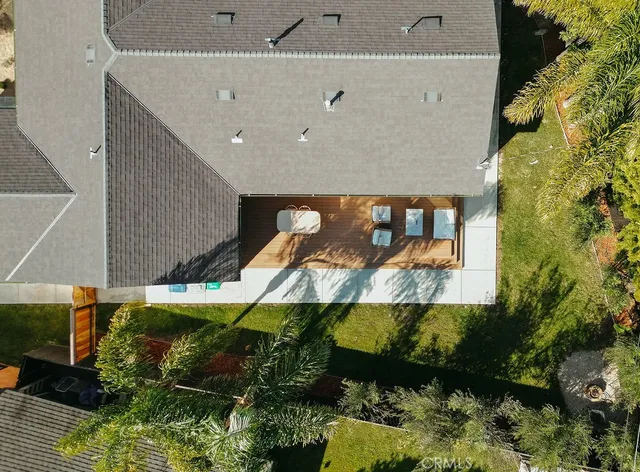 an aerial view of a house with outdoor space