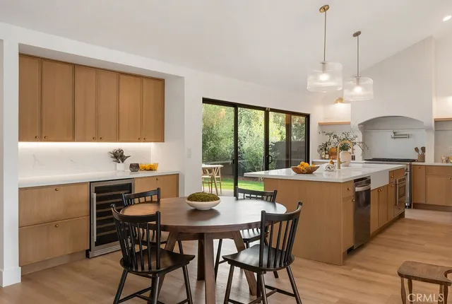 a kitchen with a table and chairs in it