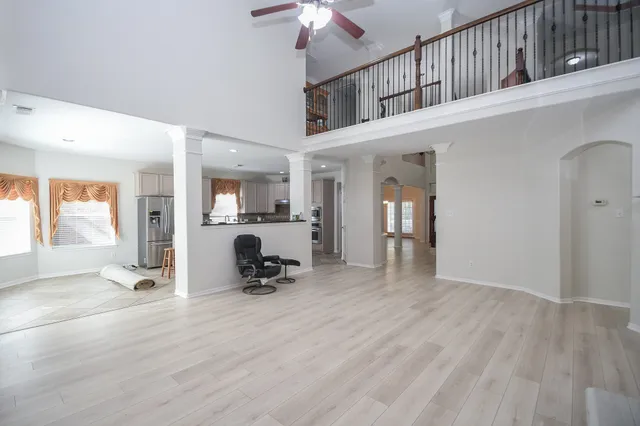 a view of an entryway with wooden floor