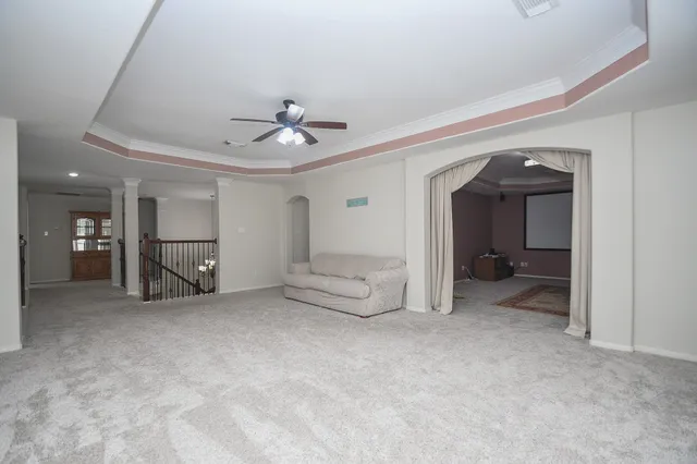 a view of a room with rack on the wall and couch