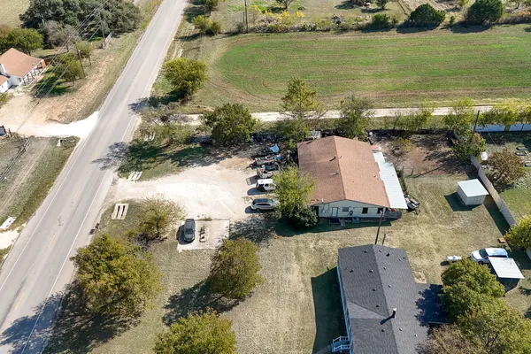 an aerial view of ocean with residential house with outdoor space