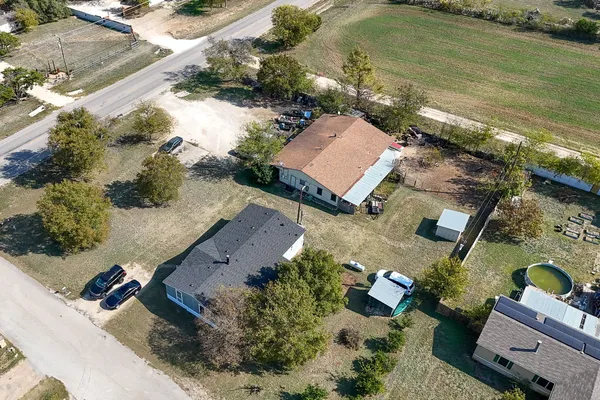 an aerial view of a house with a ocean view