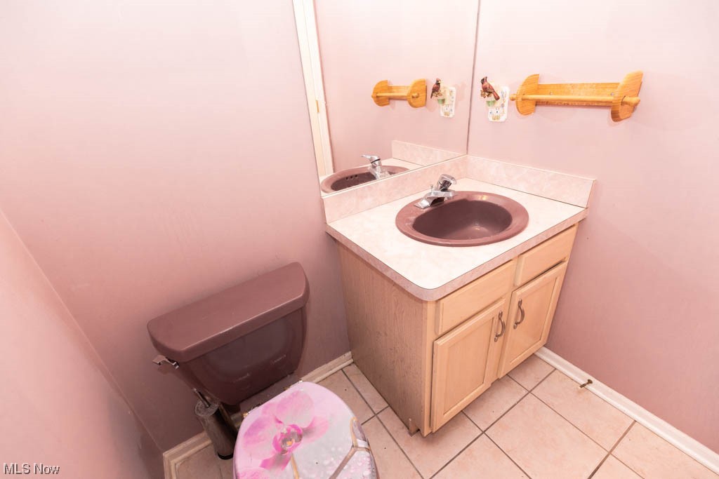 4376 Archer Road Cleveland, OH 44105 - Photo 14 of 30 Bathroom featuring toilet, tile flooring, and vanity