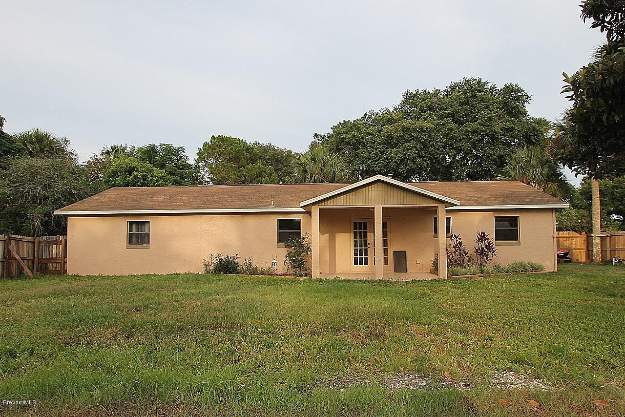 238 Capron Road Port St. John, FL 32927 - Photo 22 of 23 a front view of house with yard and green space