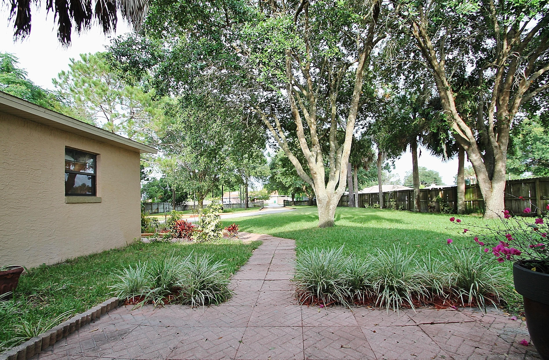 238 Capron Road Port St. John, FL 32927 - Photo 6 of 23 a view of a backyard with garden