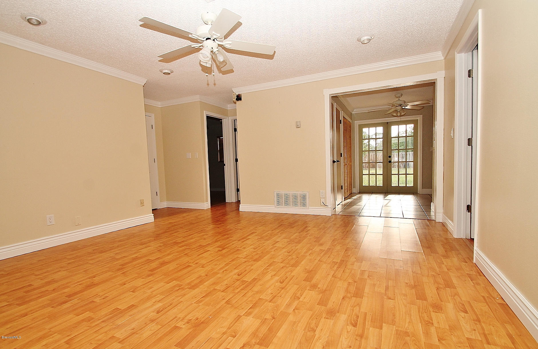 238 Capron Road Port St. John, FL 32927 - Photo 7 of 23 a view of an empty room with window and wooden floor