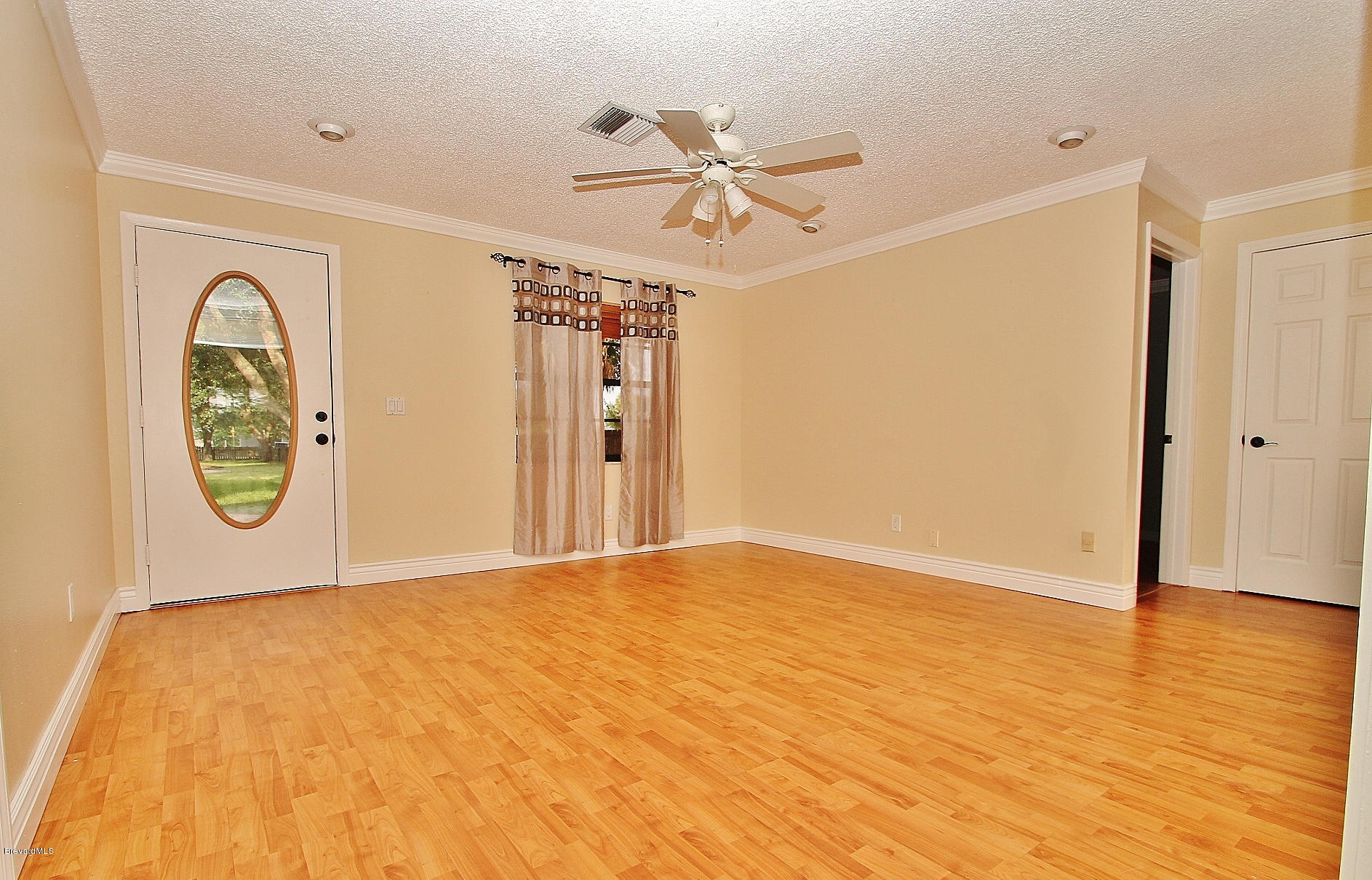238 Capron Road Port St. John, FL 32927 - Photo 8 of 23 a view of a hallway with wooden floor