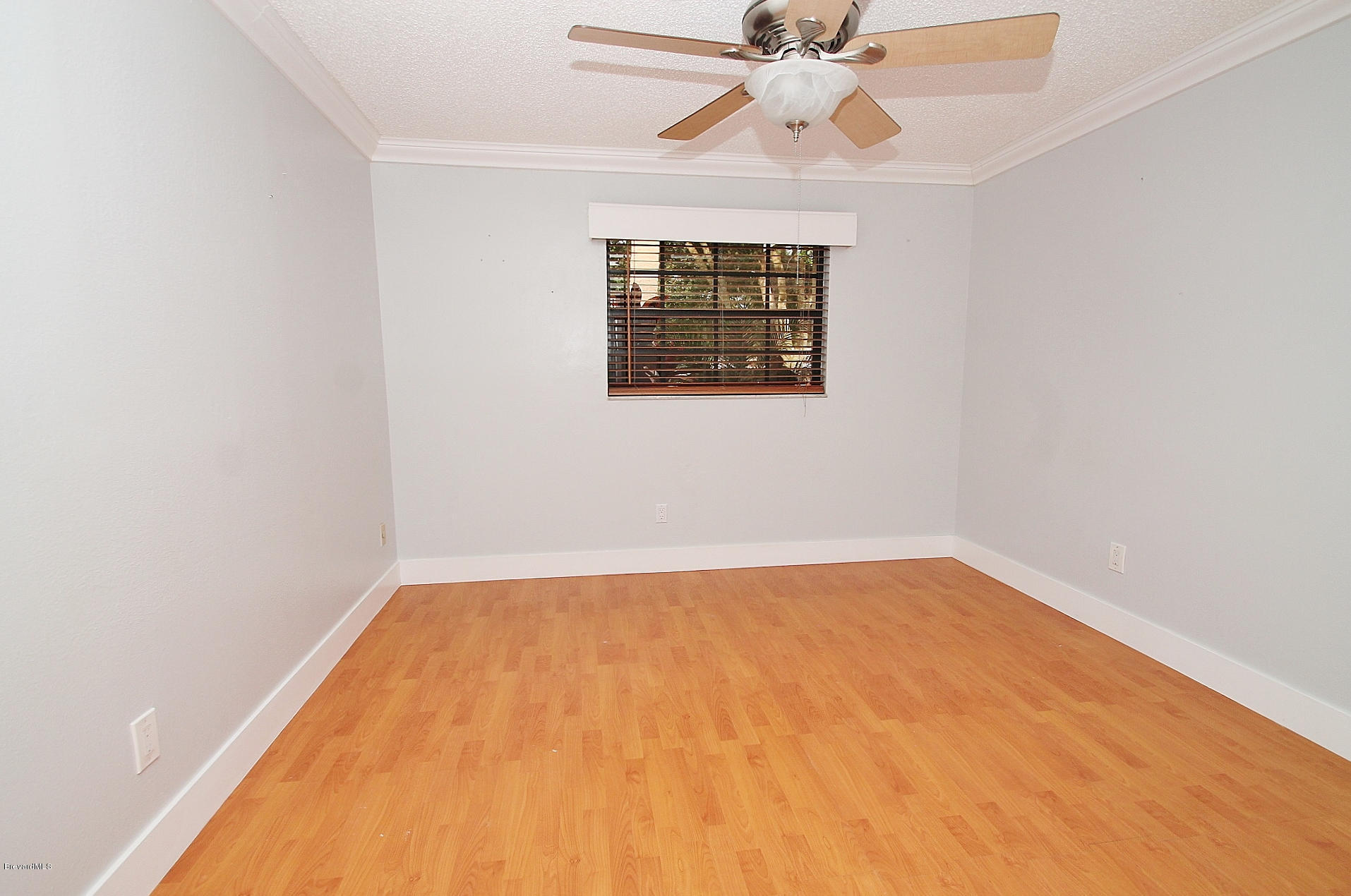 238 Capron Road Port St. John, FL 32927 - Photo 9 of 23 a view of an empty room with a window