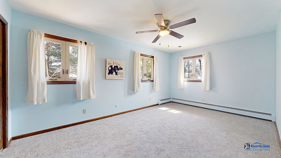 26605 West Wilmot Road Antioch, IL 60002 - Photo 17 of 30 an empty room with windows and fan