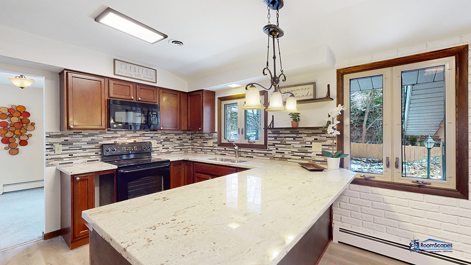 26605 West Wilmot Road Antioch, IL 60002 - Photo 2 of 30 a kitchen with stainless steel appliances granite countertop sink stove and wooden floor