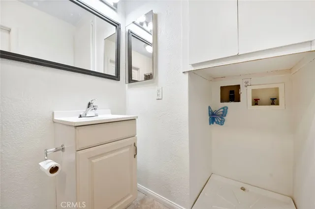 a view of a wooden deck and a backyard