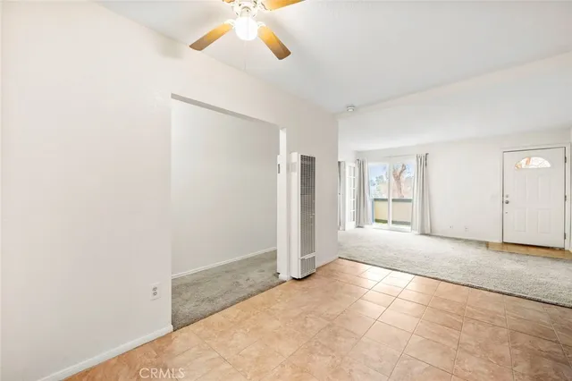a kitchen with stainless steel appliances kitchen island a refrigerator sink and cabinets