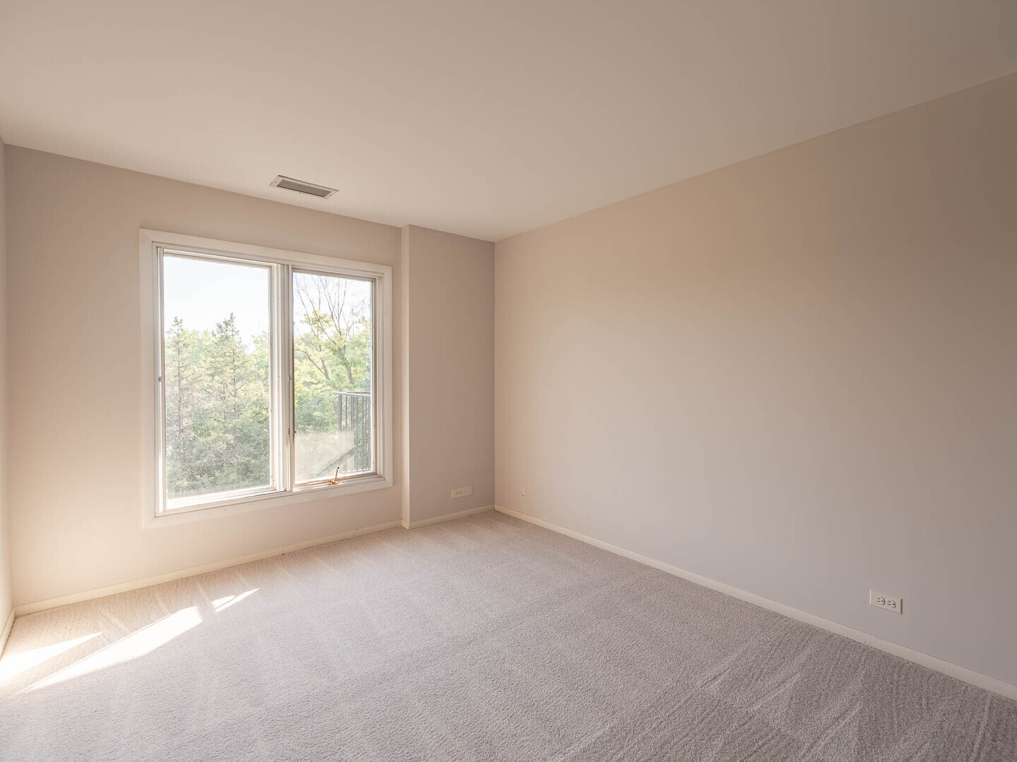 6545 Main Street, Unit 408 Downers Grove, IL 60516 - Photo 9 of 13 an empty room with a window